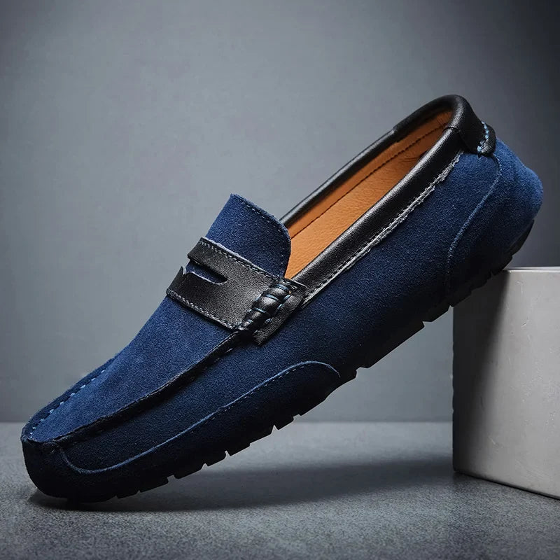 Polished red men's dress loafers. Elegant slip-on shoes for refined men's formal or casual wear.