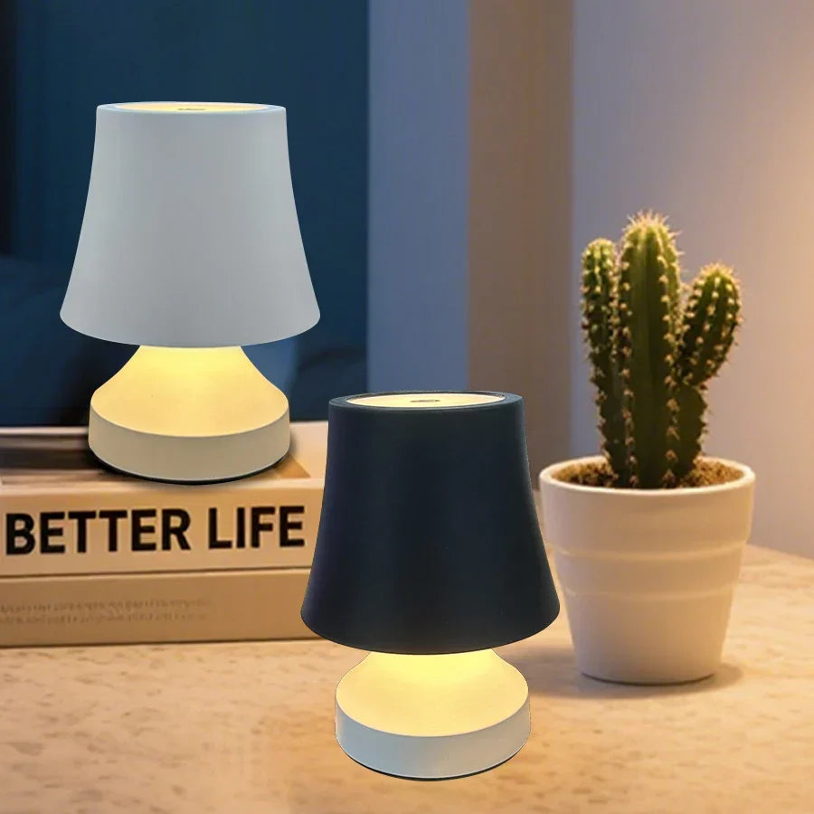 Portable cordless LED table lamp, USB rechargeable. Ideal for home office or mood lighting.