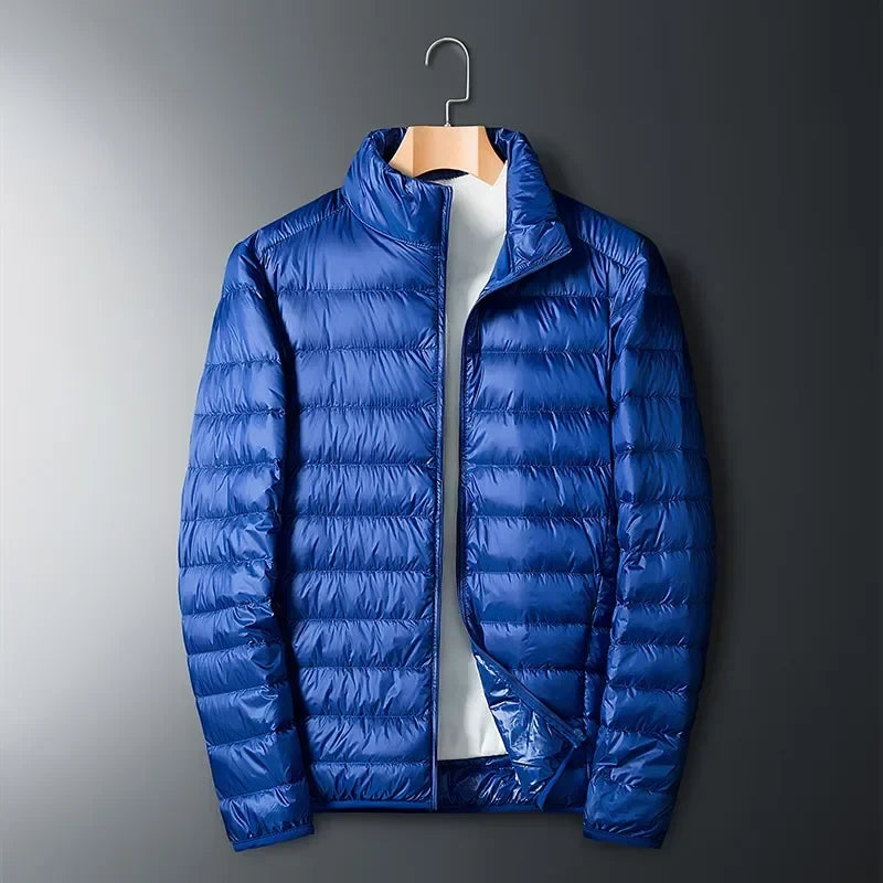 Vibrant red unisex packable puffer jacket. Lightweight, warm & waterproof for diverse outdoor travel & cold weather.