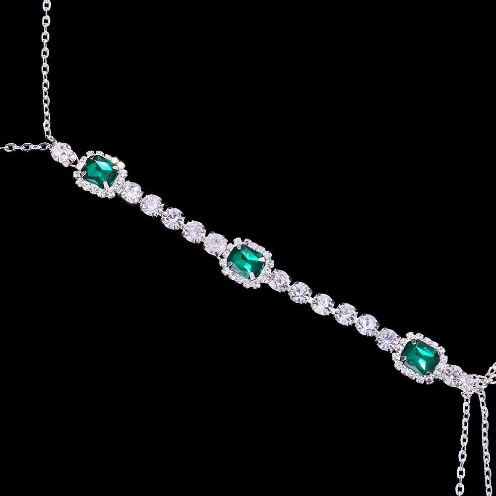 Close-up: Vibrant green crystal chest chain with shimmering rhinestones, highlighting the intricate craftsmanship.