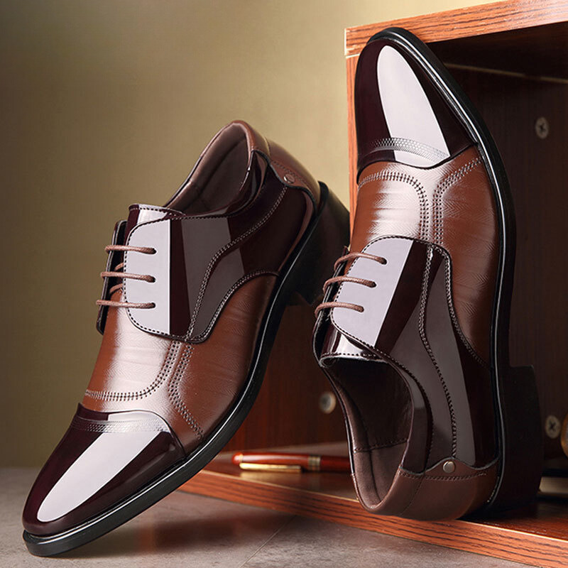 Sophisticated men's two-tone oxford dress shoes, ideal for formal events and business attire.