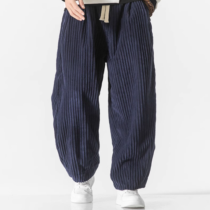 Close-up of men's wide-leg jogger waistband, featuring an elastic waist and adjustable drawstring for a custom fit.
