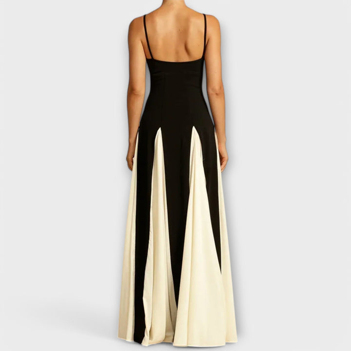 Women's long black maxi sundress featuring spaghetti straps and a comfortable, elegant flowy design for summer.