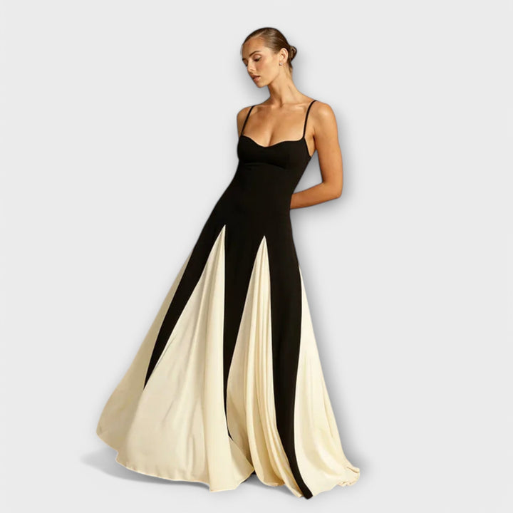 Elegant black women's maxi sundress with spaghetti straps, perfect for summer comfort and vacation wear.