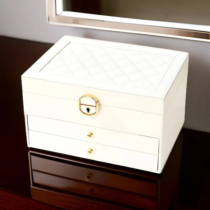 Elegant faux leather multi-tier jewelry storage box, organized accessories & chic vanity decor.