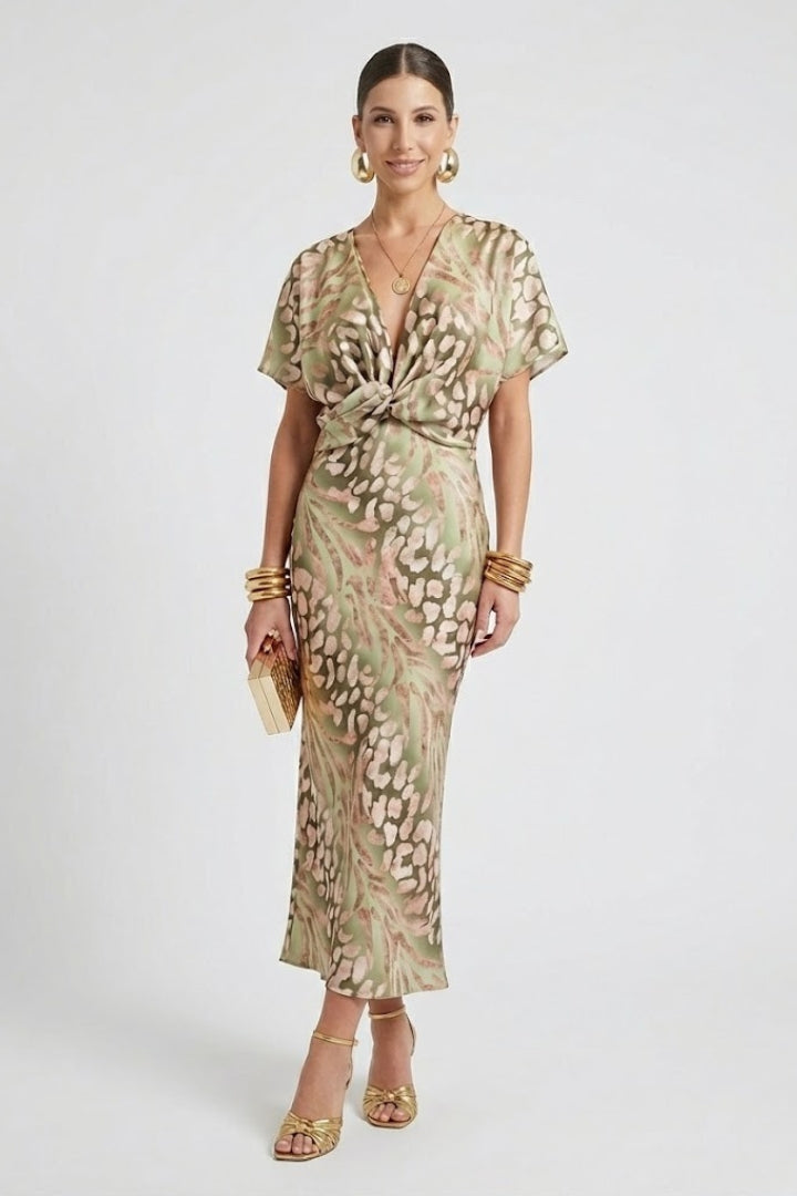 Stylish women's short sleeve floral midi dress with V-neck and pleated hem, ideal for elegant summer occasions.