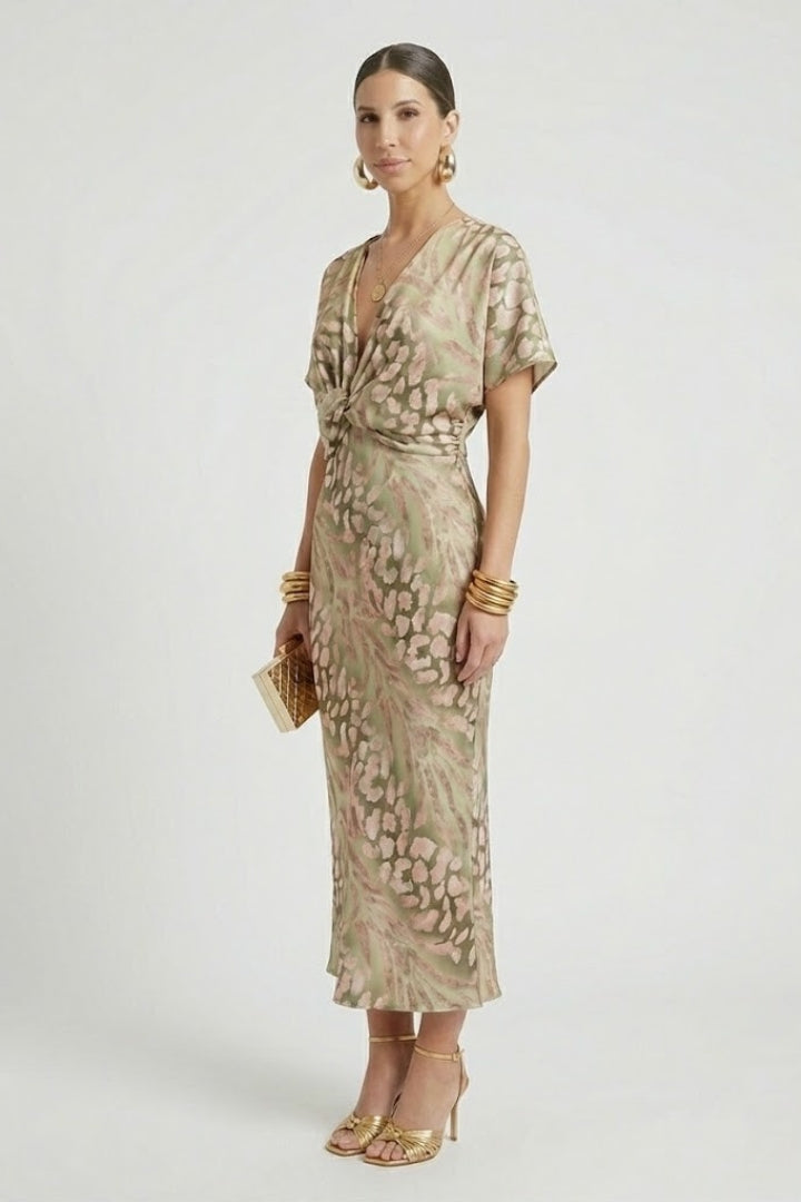 Chic women's floral midi dress with a flattering V-neck and elegant pleated hem, suitable for various occasions.