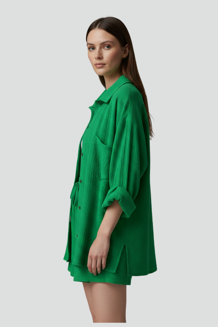 Crisp white women's two-piece lounge set. Relaxed long sleeve shirt & shorts for casual wear.