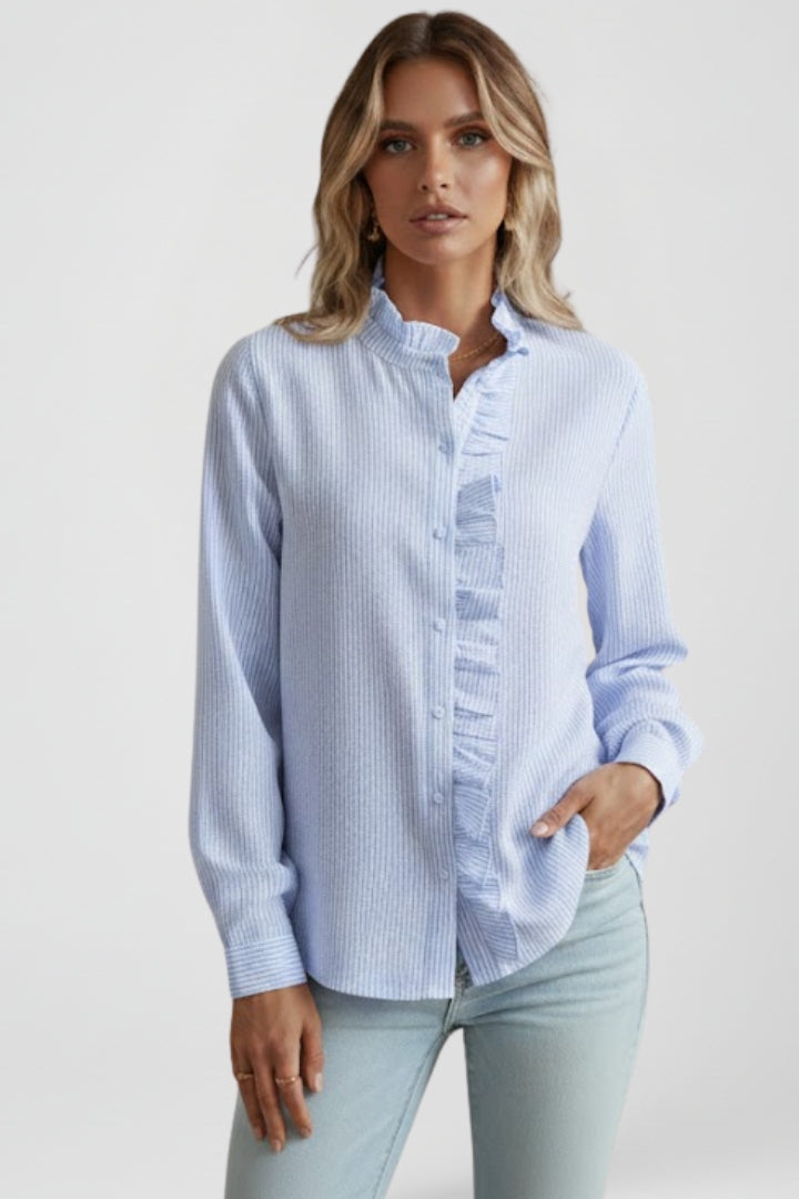 Fashionable women's textured long sleeve blouse with ruffles. Button-front design makes it perfect for chic workwear.