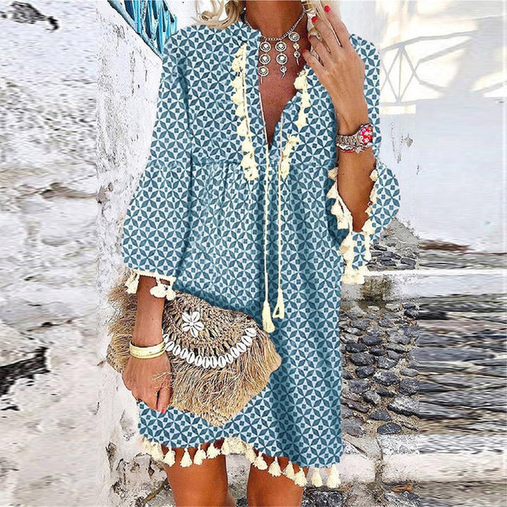 Chic Women's V-Neck Boho Mini Dress with playful tassel details & bell sleeves, perfect for summer casual wear.