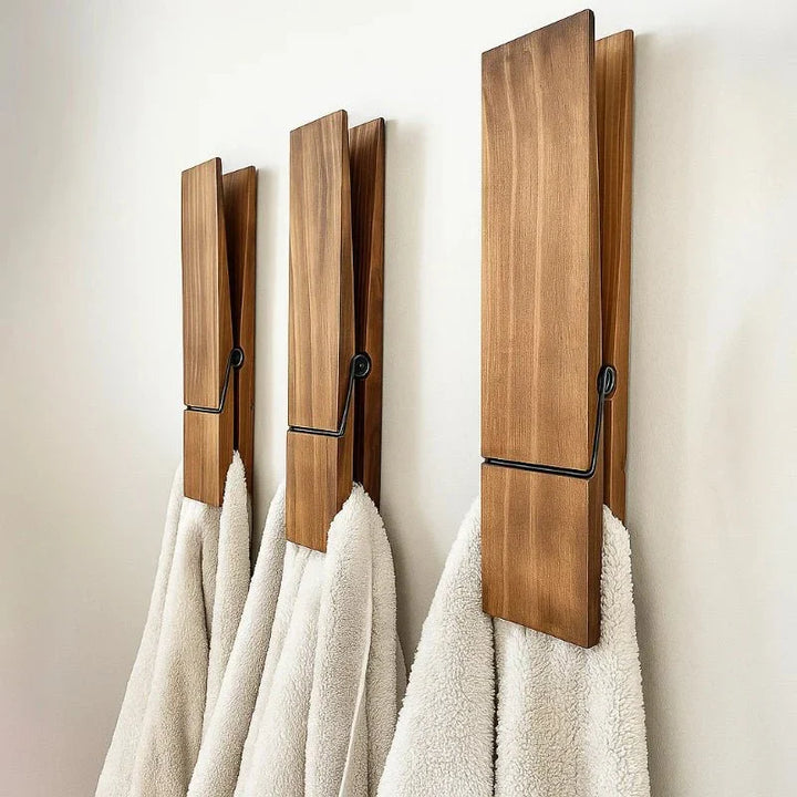 Elegant wood bathroom wall towel clip. Modern minimalist design for organized towel storage & home decor.