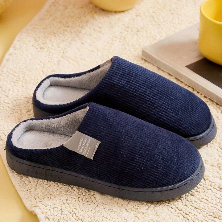 Warm and soft women's plush slippers with non-slip grip, perfect casual footwear for chilly evenings.