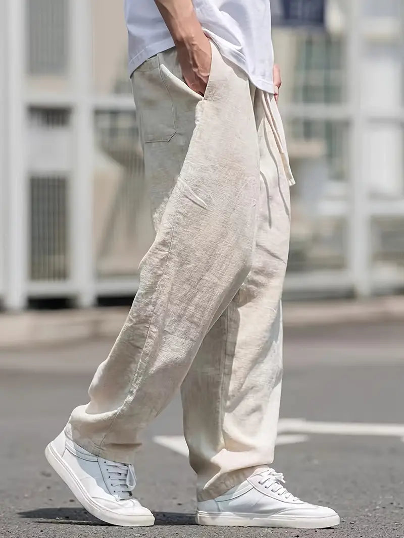 Baggy Leinenhose Herren, lässiger Schnitt, atmungsaktives Material, trendiger Look, beige Farbton, vielseitig kombinierbar.