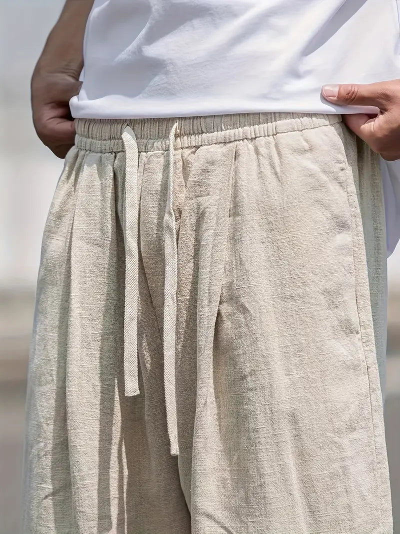 Baggy Leinenhose Herren, lässiger Schnitt, atmungsaktives Material, trendiger Look, beige Farbton, vielseitig kombinierbar.