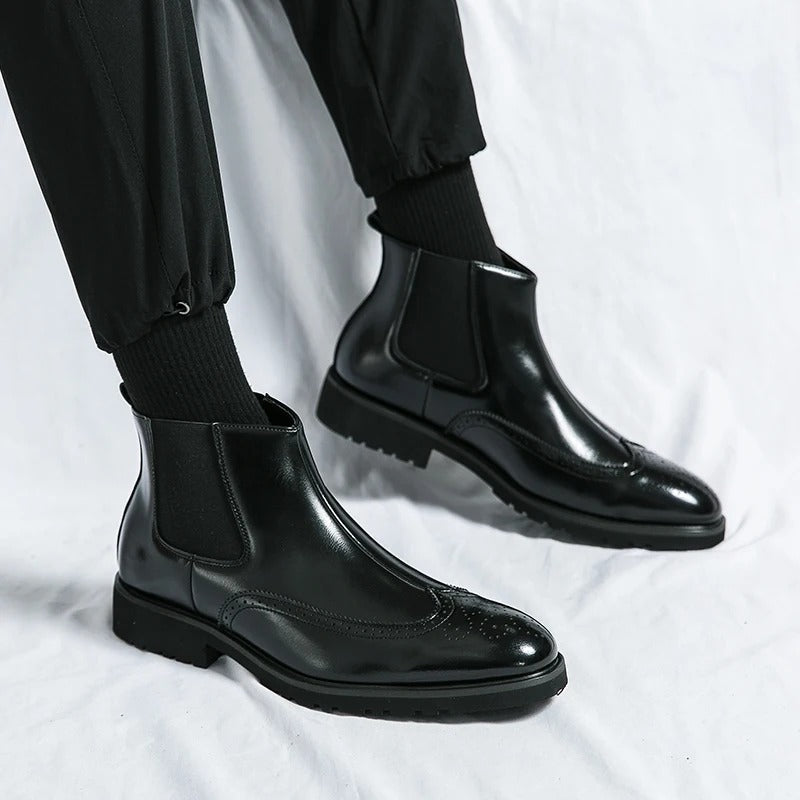 Men's smart chelsea boots, brogue accents elevate this durable design for any setting.