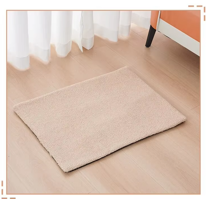 Content cat napping on a luxurious beige self-warming pet blanket, soft pet comfort accessory