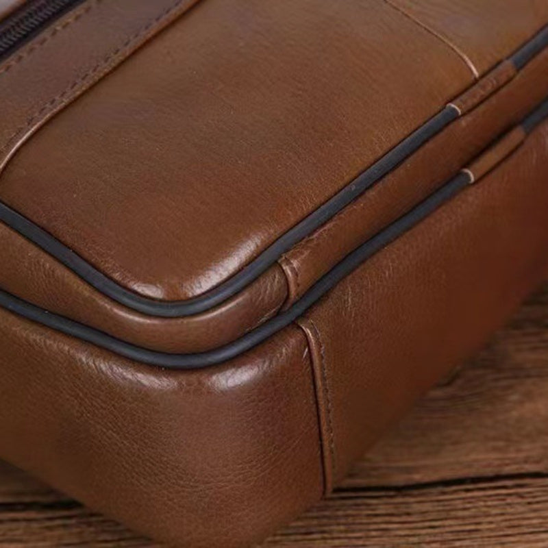 Sleek black men's crossbody bag, designed for secure everyday carry & travel convenience.