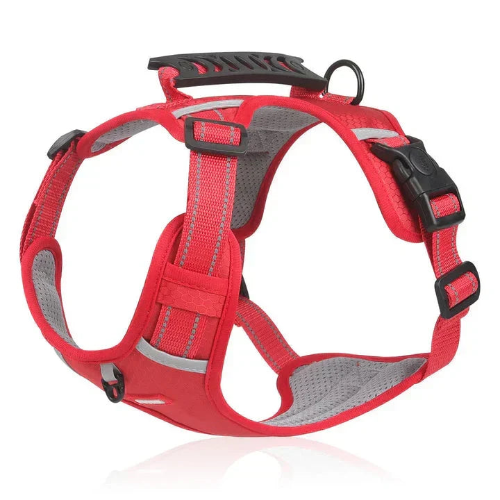 Durable, adjustable no-pull dog harness in red, featuring a padded vest design and control handle for pet safety.
