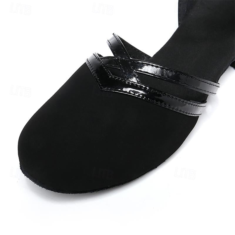 Women's black dance shoes with secure ankle strap, perfect for professional performance and comfortable dancewear.