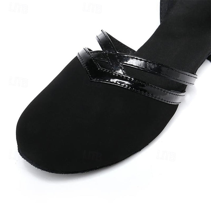 Women's black dance shoes with secure ankle strap, perfect for professional performance and comfortable dancewear.