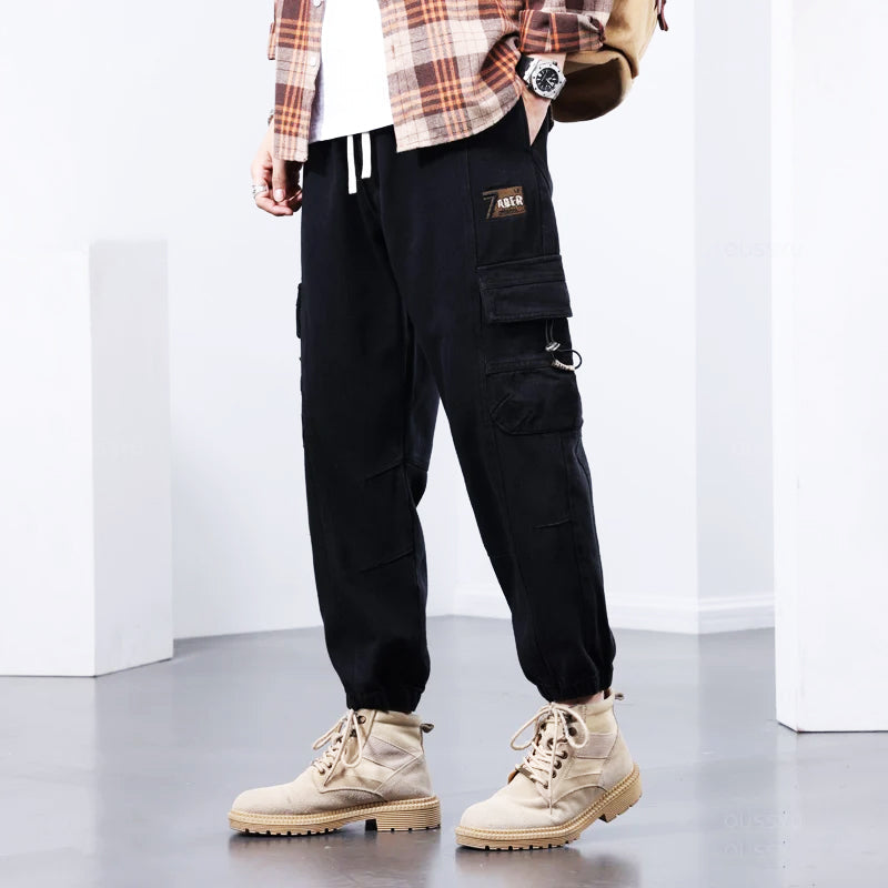 Brown men's utility cargo pants, perfect for everyday wear, workwear, or streetwear. Comfortable & stylish multi-pocket design.