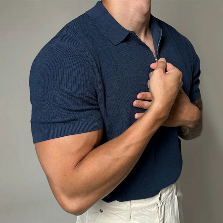 Close-up of the stylish zip-up collar on a men's modern tailored polo shirt. Slim fit knit design.