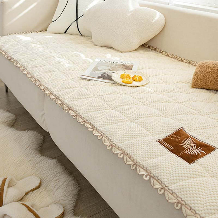 Bread shape chenille non-slip couch cover in warm beige, protecting a sectional sofa