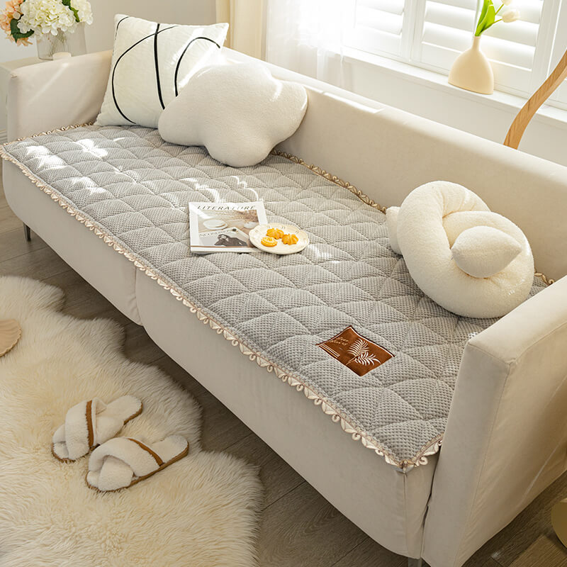 Full view of a bread shape chenille non-slip couch cover on a diverse sectional
