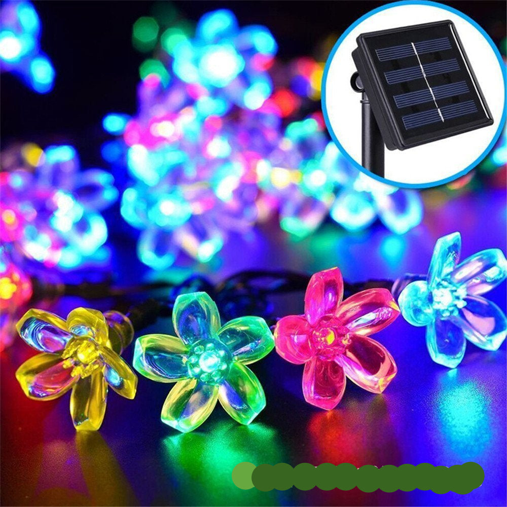 "Bunte Solar Blumenlichterkette im Garten bei Nacht, wetterfest, umweltfreundlich, Blumenform, stimmungsvolle Beleuchtung"