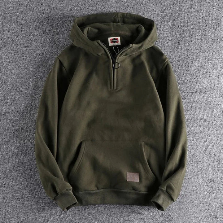 Stylish men's quarter-zip hoodie, ideal for layering in colder weather, a must-have for winter fashion.