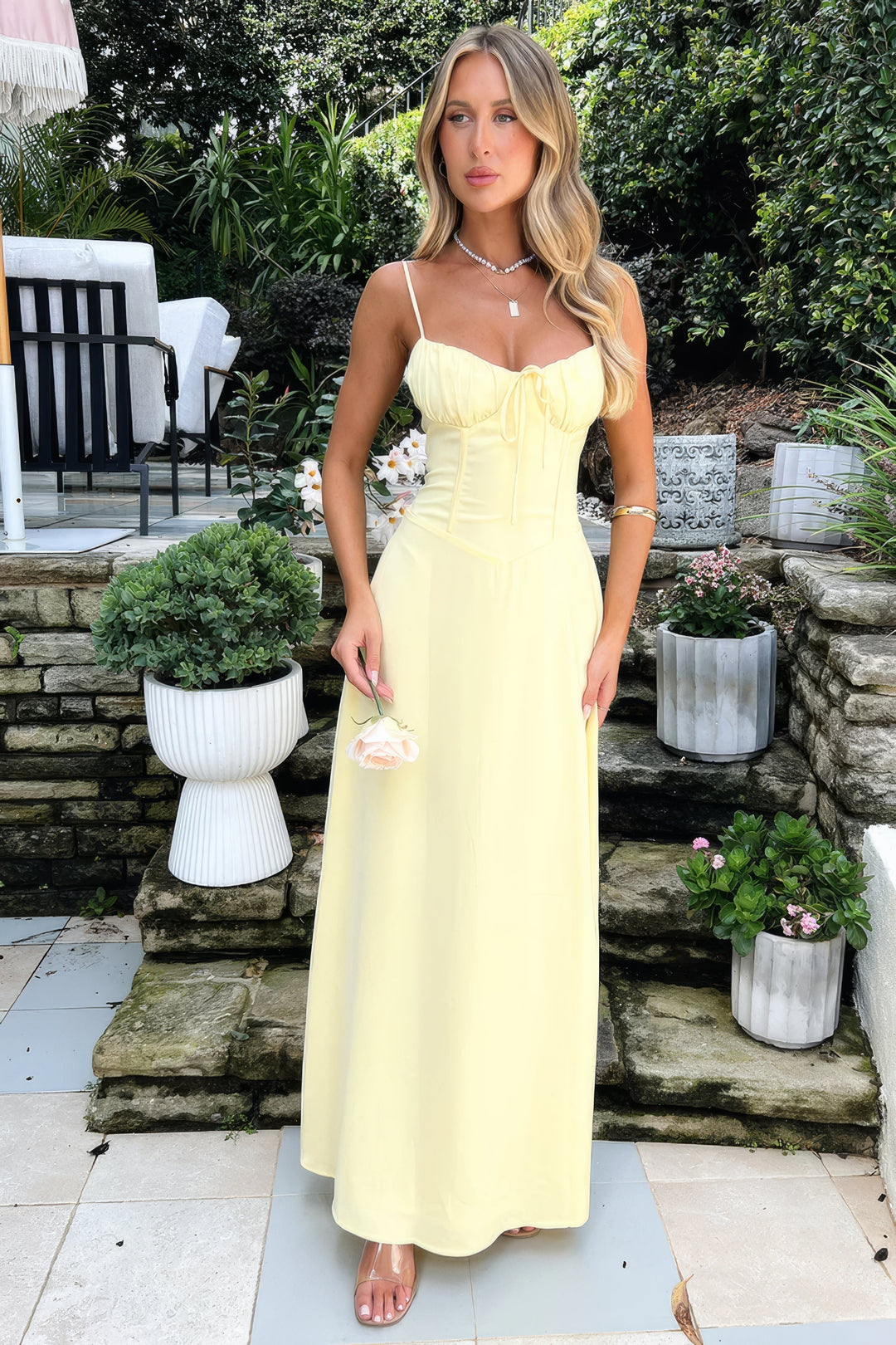 Chic women's sleeveless A-line maxi dress, tie-front design. Perfect for summer parties & casual elegance.