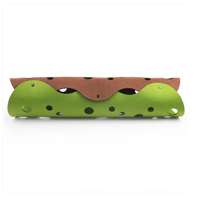 Interactive pet accessory: a flexible gray felt cat tunnel with several peek holes on a hardwood floor.