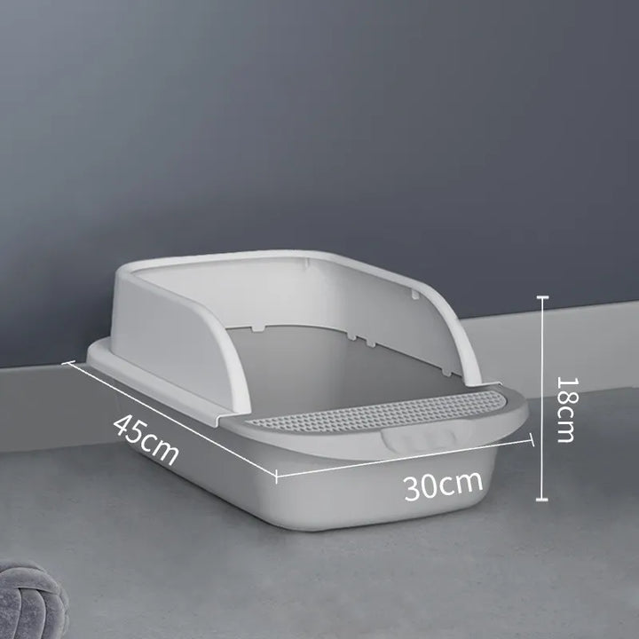 Cat litter tray on a protective mat, illustrating effective litter containment and care