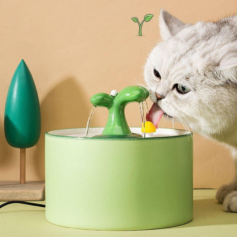 Close-up of the double filtration system in a ceramic pet water fountain, highlighting clean water supply.