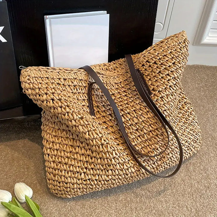 Oversized straw tote bag with sturdy handles, perfect for women's beach days & summer adventures.