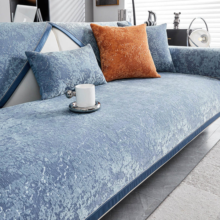 Close-up of soft chenille sofa protector texture, showing anti-scratch durability