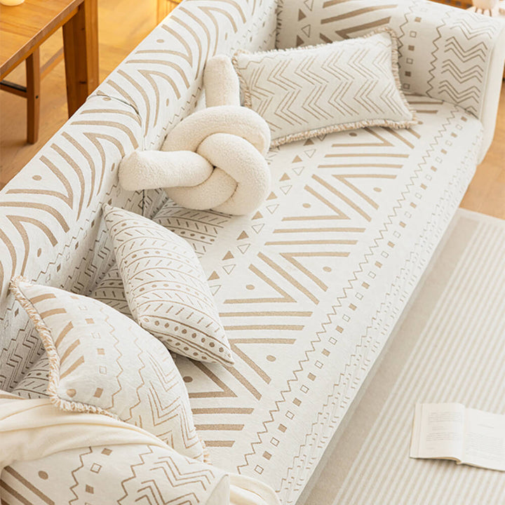 Chenille fabric sectional couch cover in a neutral color, offering breathable pet-friendly sofa protection.