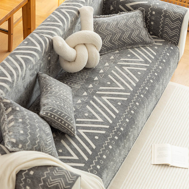Close-up of chenille fabric texture on a sectional sofa cover, highlighting its breathable quality.