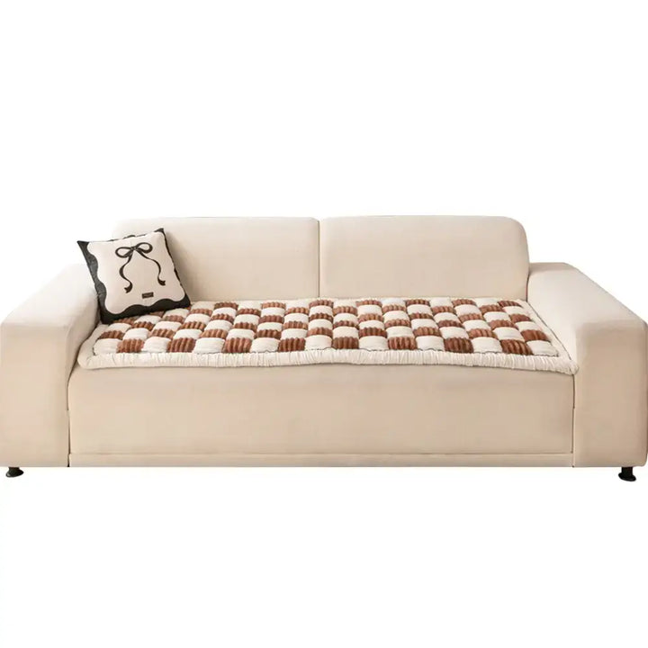 Cozy chenille pet bed on a sofa, providing a safe and clean space for your dog or cat