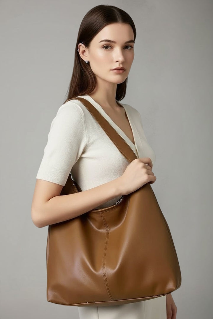 Elegant women's spacious tote, designed as a fashionable everyday carryall. Perfect for the organized professional.