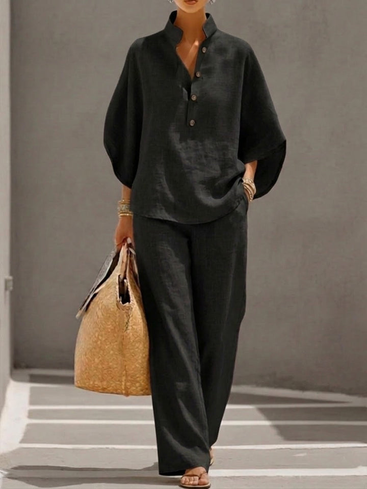 Chic women's batwing blouse & wide leg trousers set. Effortless style for a comfortable matching outfit.
