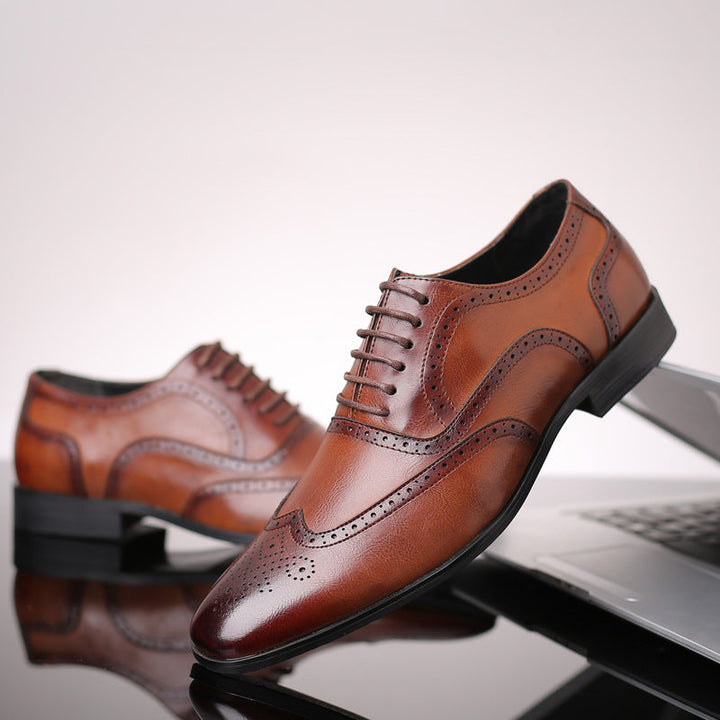 Classic black men's Oxford brogue dress shoes for formal events & business attire.