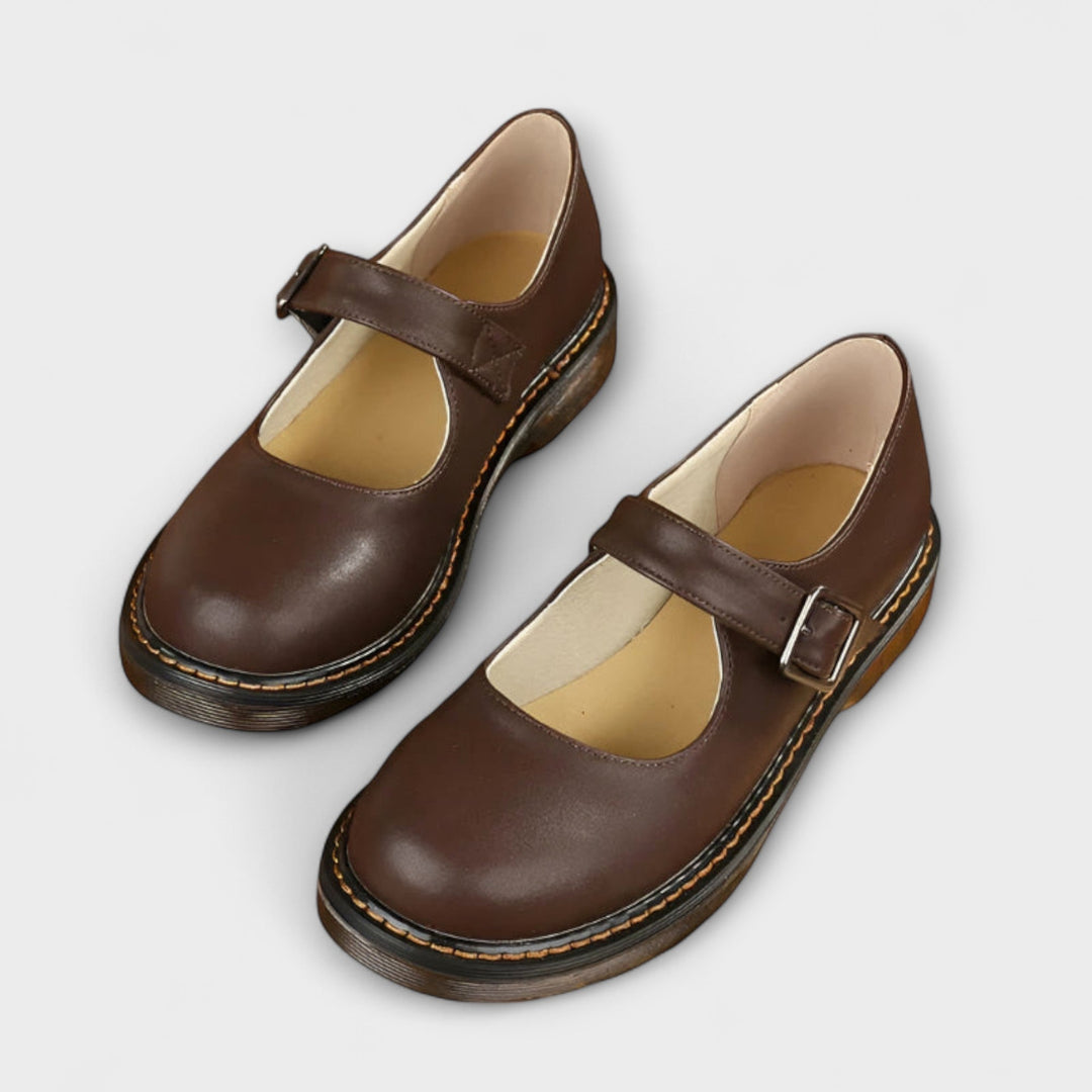 Classic women's Mary Jane flats in black with buckle strap. Timeless, comfortable for work or everyday wear.