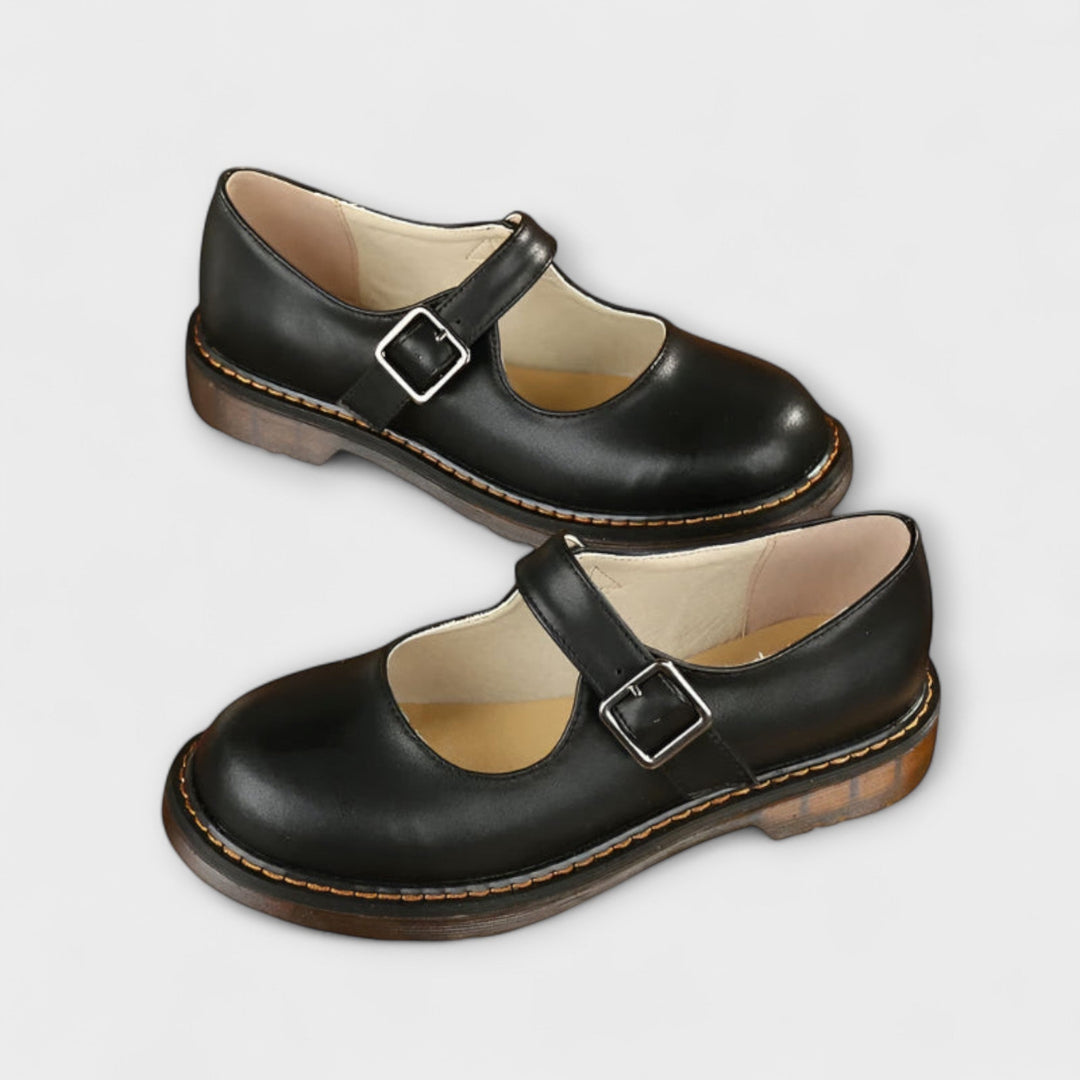 Comfortable classic women's Mary Jane flats. Brown vintage-style everyday shoe with buckle strap and round toe.