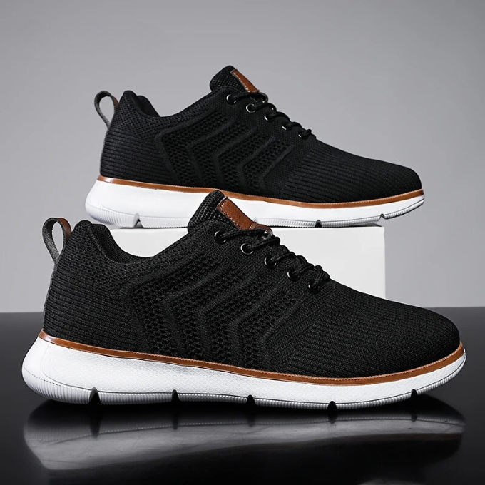 Studio shot of Men's Airmesh Stride Running Sneakers, emphasizing sleek design & athletic footwear features.