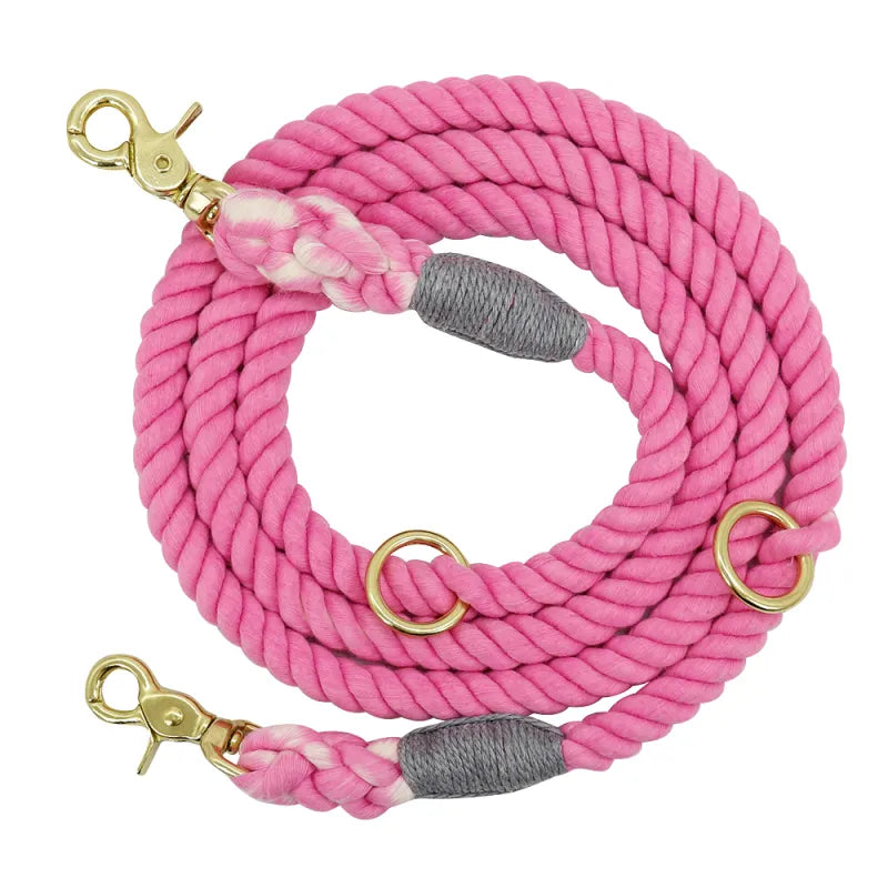 Close-up of a colorful cotton rope dog leash showing its texture and a shiny a snap hook, perfect for pet supplies.