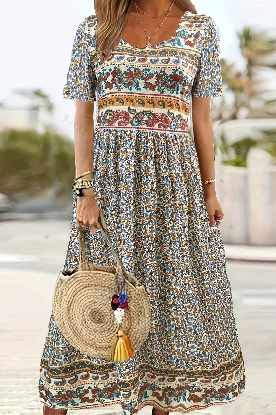 Versatile women's printed midi dress, comfortable and knee-length, ideal for stylish everyday wear.