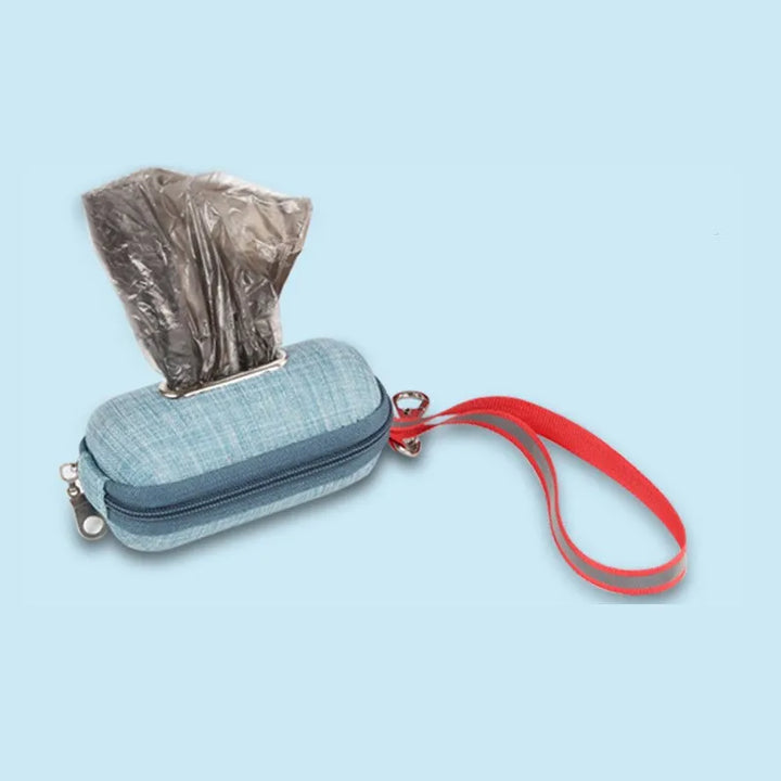Pet waste bag dispenser, gray, securely clipped to a belt loop, convenient dog accessory for hygiene