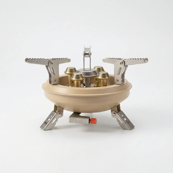 Portable butane camping stove with wind shield and piezo ignition, perfect for backpacking and travel cooking.
