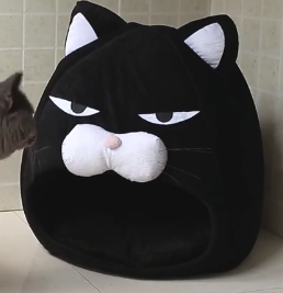 Soft black cat cave pet bed, perfect for small dogs or cats seeking comfort